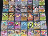 a close up of a pile of pokemon cards sitting on top of a table