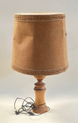 a lamp that has a brown shade on top of it