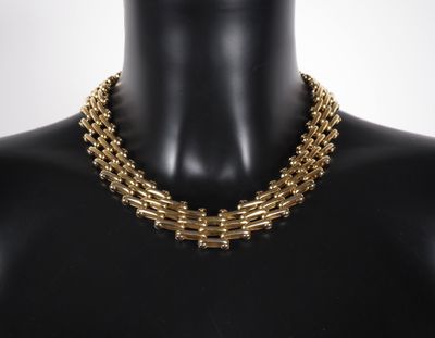 a close up of a mannequin necklace on a mannequin mannequin mannequin mann