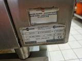 a label on the back of a machine that is on display