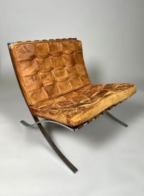 an image of a chair made out of wood with a metal frame