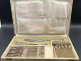 an image of a case with silverware in it sitting on a table