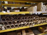 many rolls of toilet paper on the shelves in the warehouse