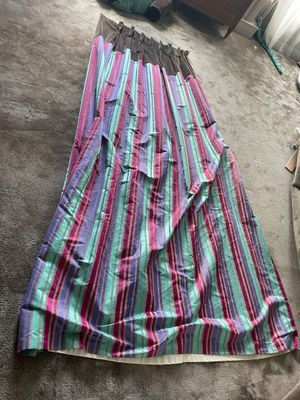 a close up of a skirt laying on the floor in a room