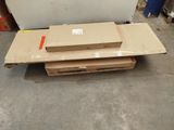 a stack of boxes sitting on the floor next to a refrigerator