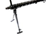 a machine gun that is sitting on top of a tripod