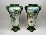 pair of green vases with flowers and leaves painted on them