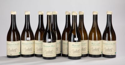 six bottles of wine are lined up in a row on a table