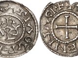 a silver coin with a cross on the front and a cross on the back
