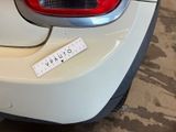 a sticker on the back of a white car
