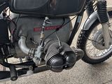 a motorcycle that is parked on the side of the street