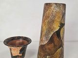 a vase and a vase with a picture of a deer on it