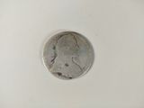 a close up of a coin on a white surface with a white background