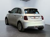 a small car that is parked in a room