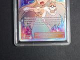 an image of a pokemon card with a picture of a woman holding a pokemon ball