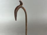 a close up of a metal object with a bird on it