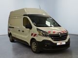 a white van with red and white stripes parked in a room