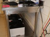 an image of a computer desk with a monitor and other electronics