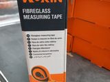 an orange box of wokin fireglass measuring tape sitting on a table