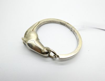 silver ring with a horse head on the side of it