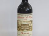 a bottle of wine that is sitting on a table