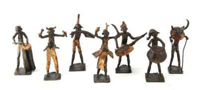 six bronze figurines of a group of people with horns and spears