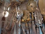 a lot of silver spoons and forks on the table