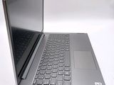 a laptop computer that is open on a white surface