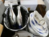 a lot of dishes and cups in a basket