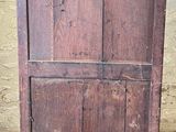 an old wooden cabinet sitting on a tiled floor