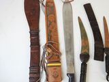 several different types of knives are displayed on a white surface