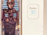 a figurine of an egyptian woman in a box