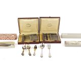 a lot of silverware in a case on the table