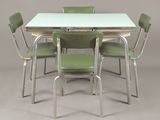 a table with four green chairs and a white table