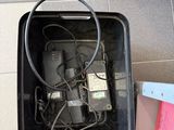 a black box with wires in it sitting on the floor