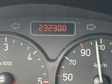 a close up of a speedometer on a car ' s dashboard