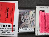 a drawing of a nude on a piece of paper next to a concert ticket