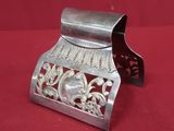 an old silver metal money box on a red cloth