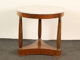 une image représentant une table ronde avec un plateau en marbre