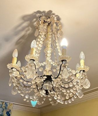 a chandelier hanging from the ceiling in a room