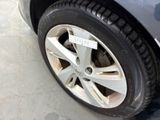a close up of a car tire with a sticker on it