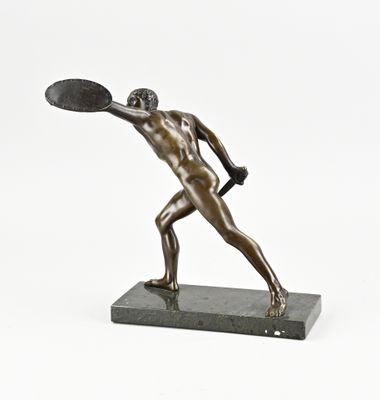 bronze statue of a man holding a tennis racquet on a marble base