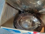 a box with a metal bowl inside of it
