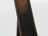 a close up of a wooden chair with a rope on it