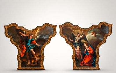 two paintings of angels on a wall with a white background