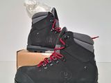 grey hiking boots with red laces on top of a box