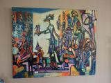 un tableau accroché au mur au-dessus d'un lit dans une chambre