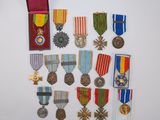 several medals and medals are displayed on a white surface