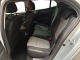 the back seats of a car with a seat belt in the back of it