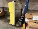 a stack of chairs in a warehouse next to boxes